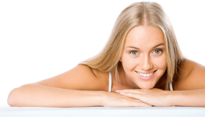 A Woman Sitting On A Bed Posing For The Camera