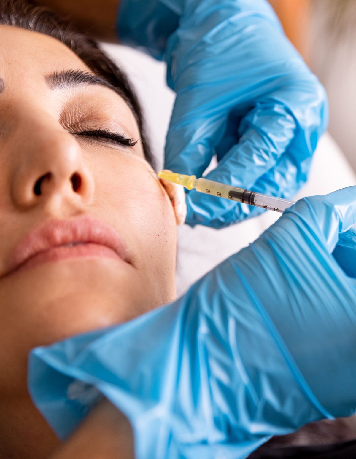 a close up of a person doing botox